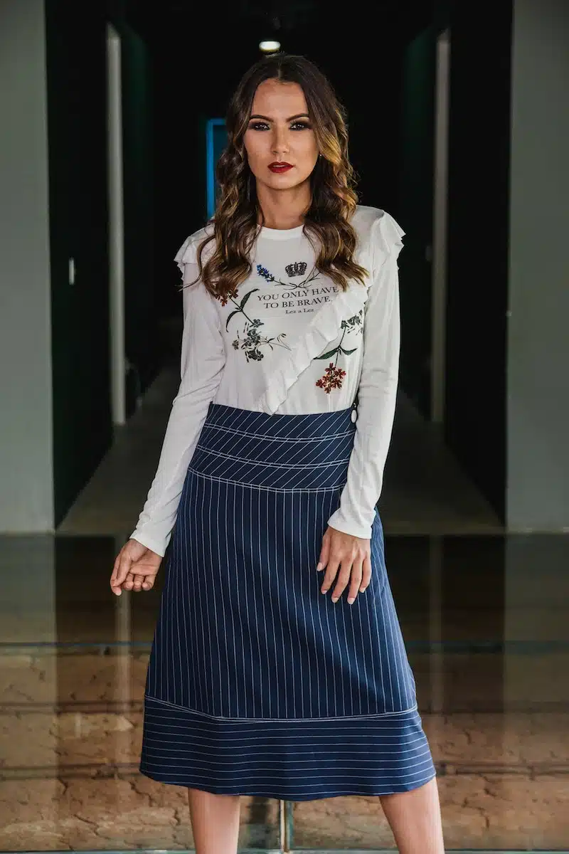 Photo of Woman Wearing Long sleeved Top and Long Skirt